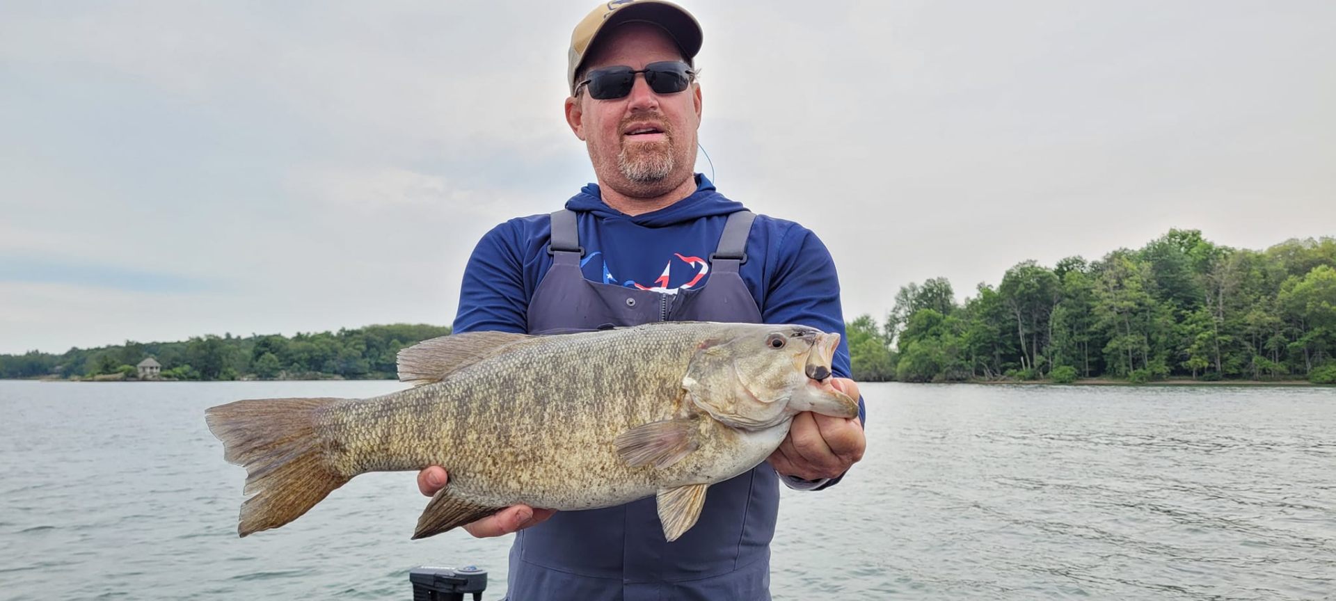 Client holding a big smallmouth bass