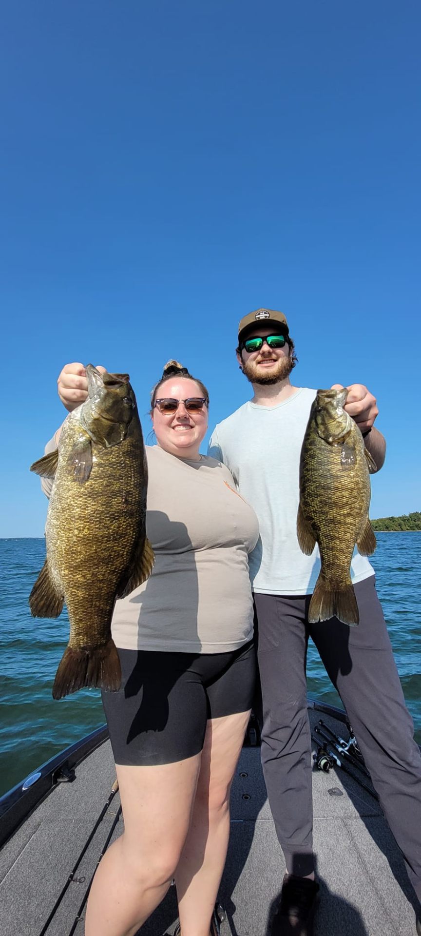 Couple showing off two smallmouth bass
